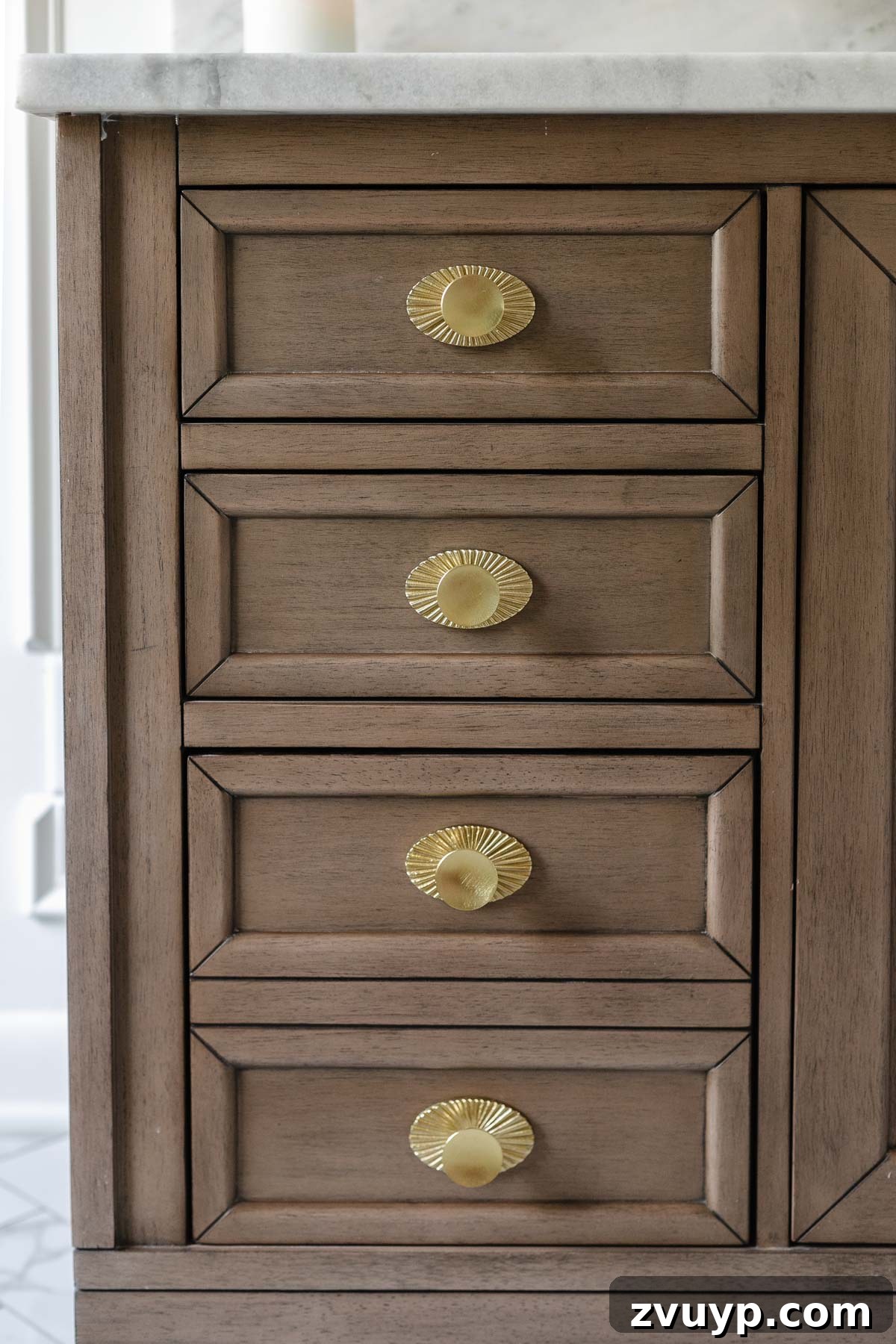 The Perfect Blend: Modern Vintage En Suite Bathroom Tour 9 Close-up of Art Deco inspired brushed gold hardware on the bathroom vanity, emphasizing detailed craftsmanship