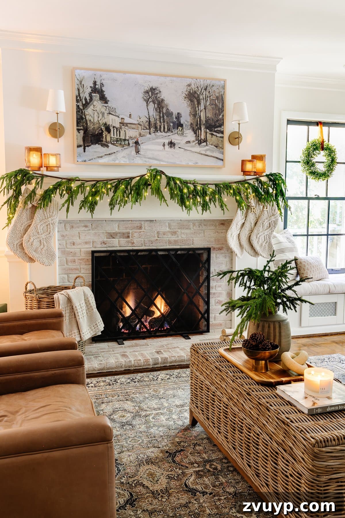2021 Holiday Home Tour Classic Christmas Decor 27 Samsung Frame TV Christmas art above fireplace with neutral Christmas decor