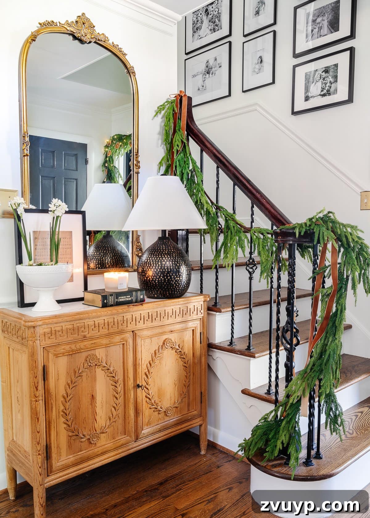 2021 Holiday Home Tour Classic Christmas Decor 3 Christmas foyer decor ideas with garland on stairs and copper ribbon
