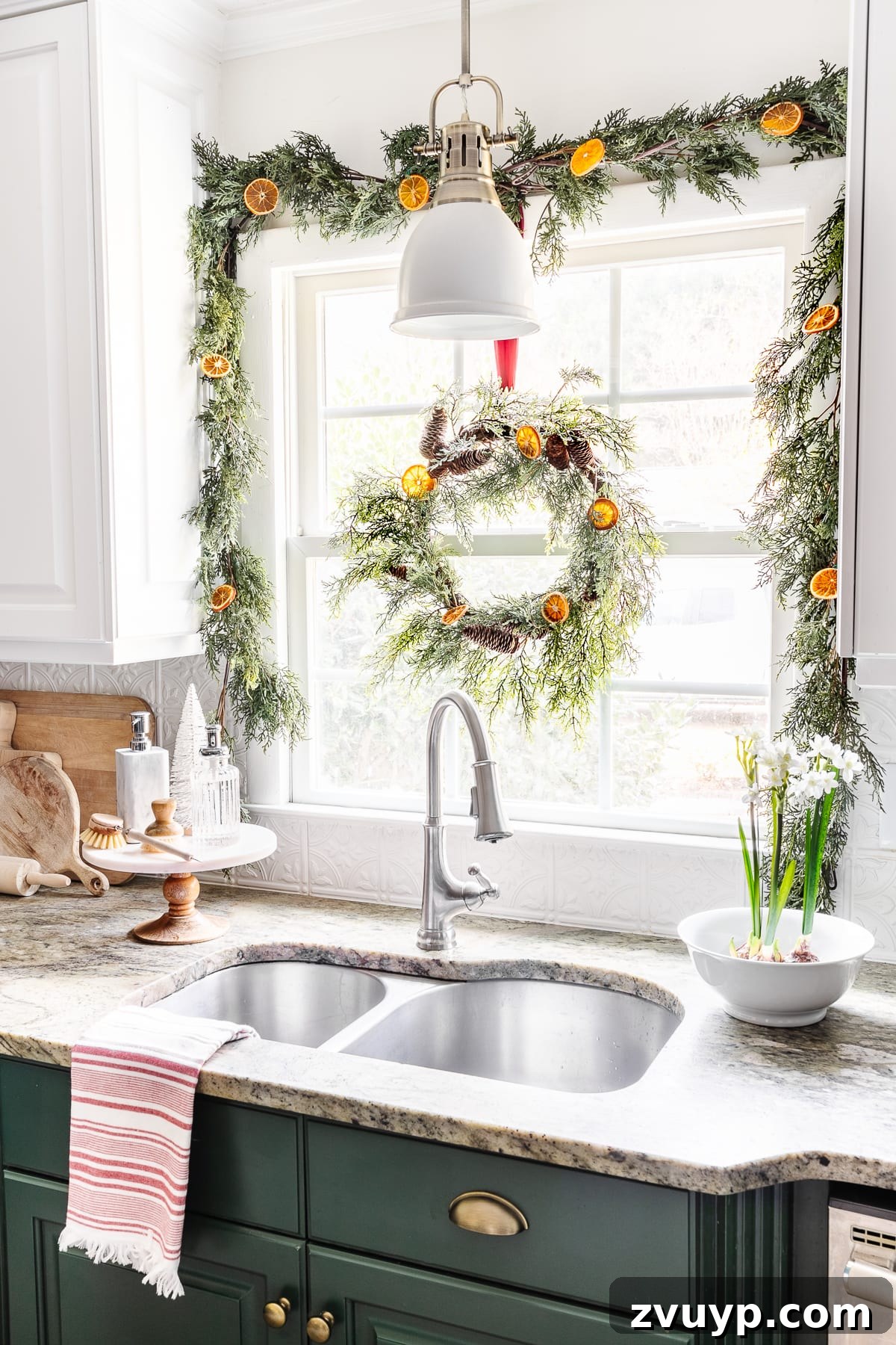 Effortless Homemade Dried Orange Garland 13 dried orange slices on garland and wreath around kitchen window