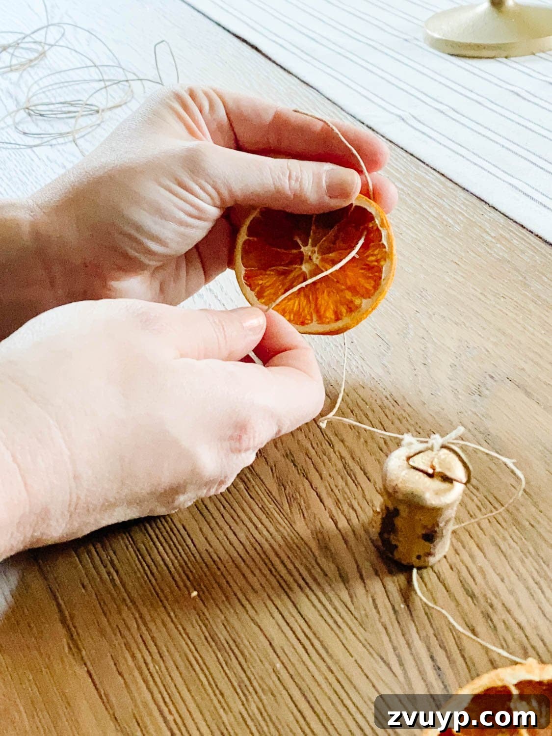 Effortless Homemade Dried Orange Garland 5 how to thread dried orange slices