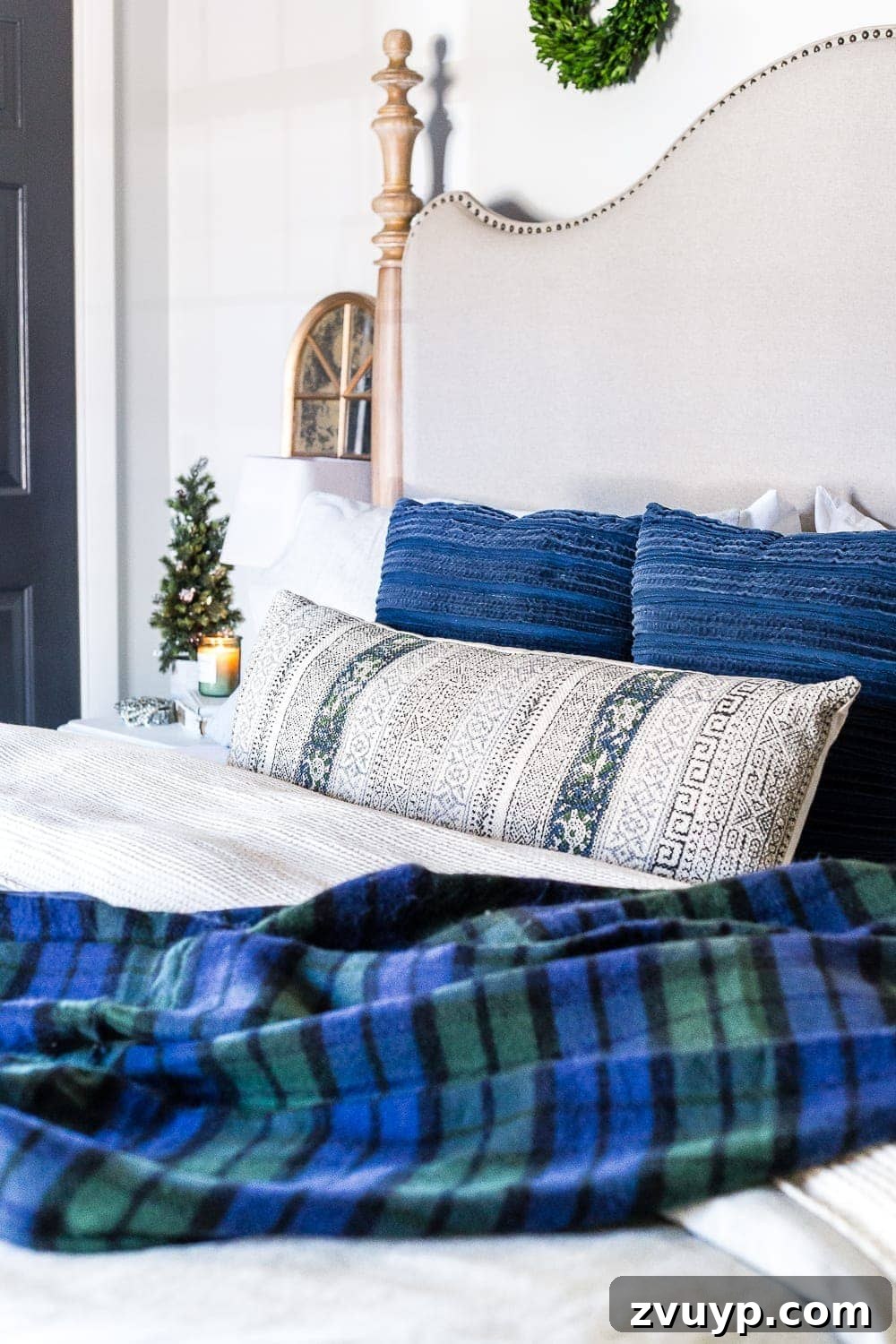Simple Festive Touches for a Winter Cozy Bedroom 23 green and blue plaid blanket on a bed