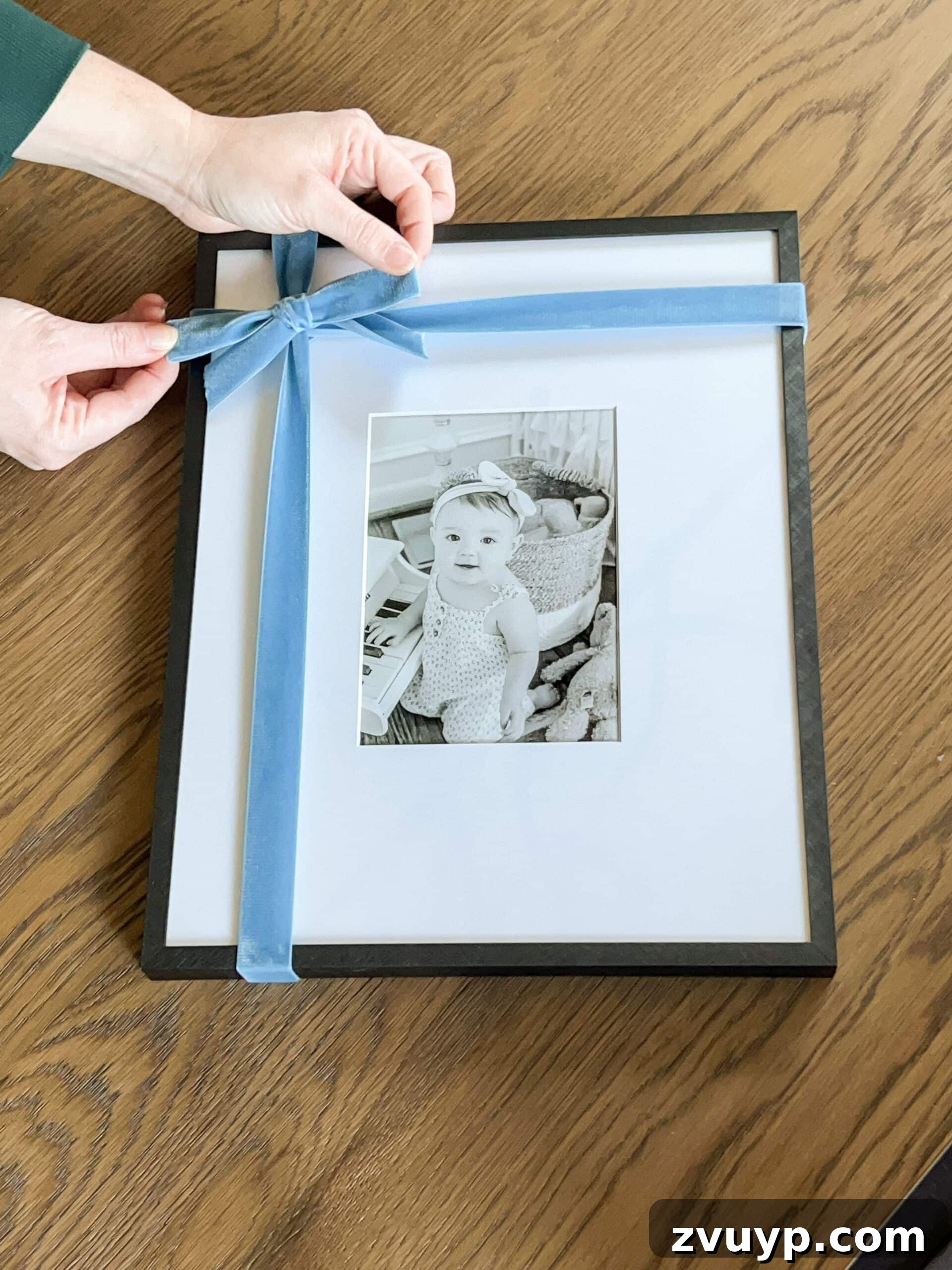 Simple Festive Touches for a Winter Cozy Bedroom 7 tying a bow around a picture frame