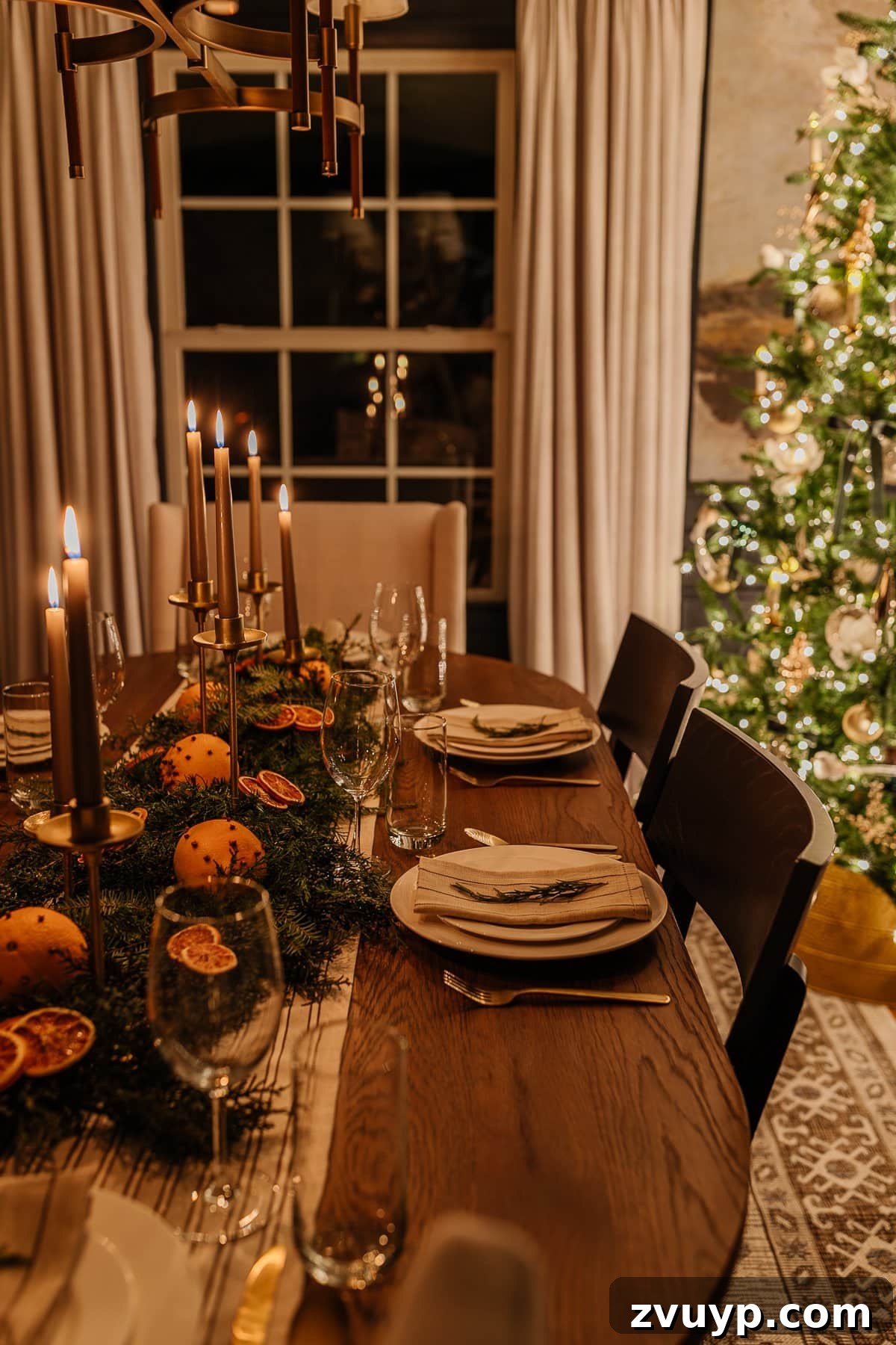 Enchanted Glow Tour 12 Another perspective of the Christmas dining room table decor at night, emphasizing the enchanting effect of candlelight on holiday decorations and a beautifully set table.