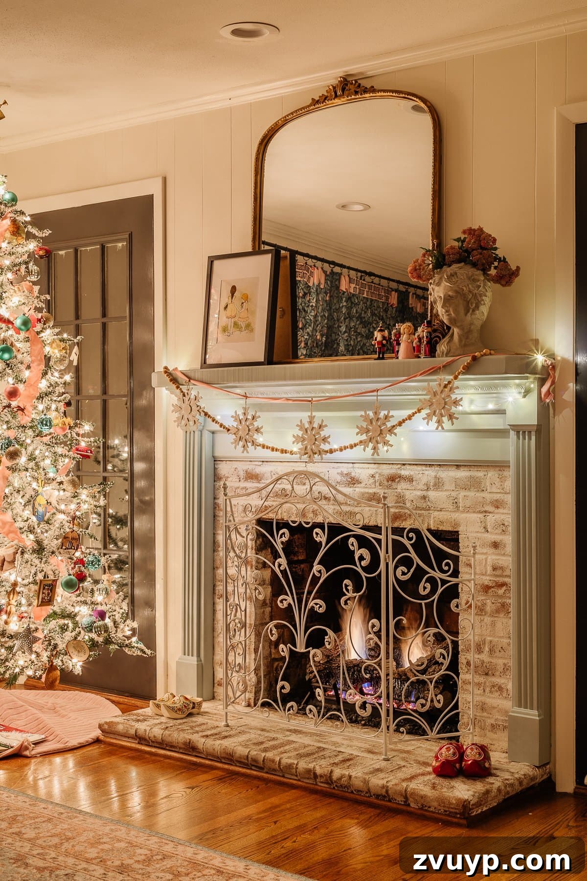 Enchanted Glow Tour 19 A Christmas playroom featuring a beautifully decorated mantel and a sparkling tree at night, creating a warm and festive atmosphere for holiday playtime and relaxation.