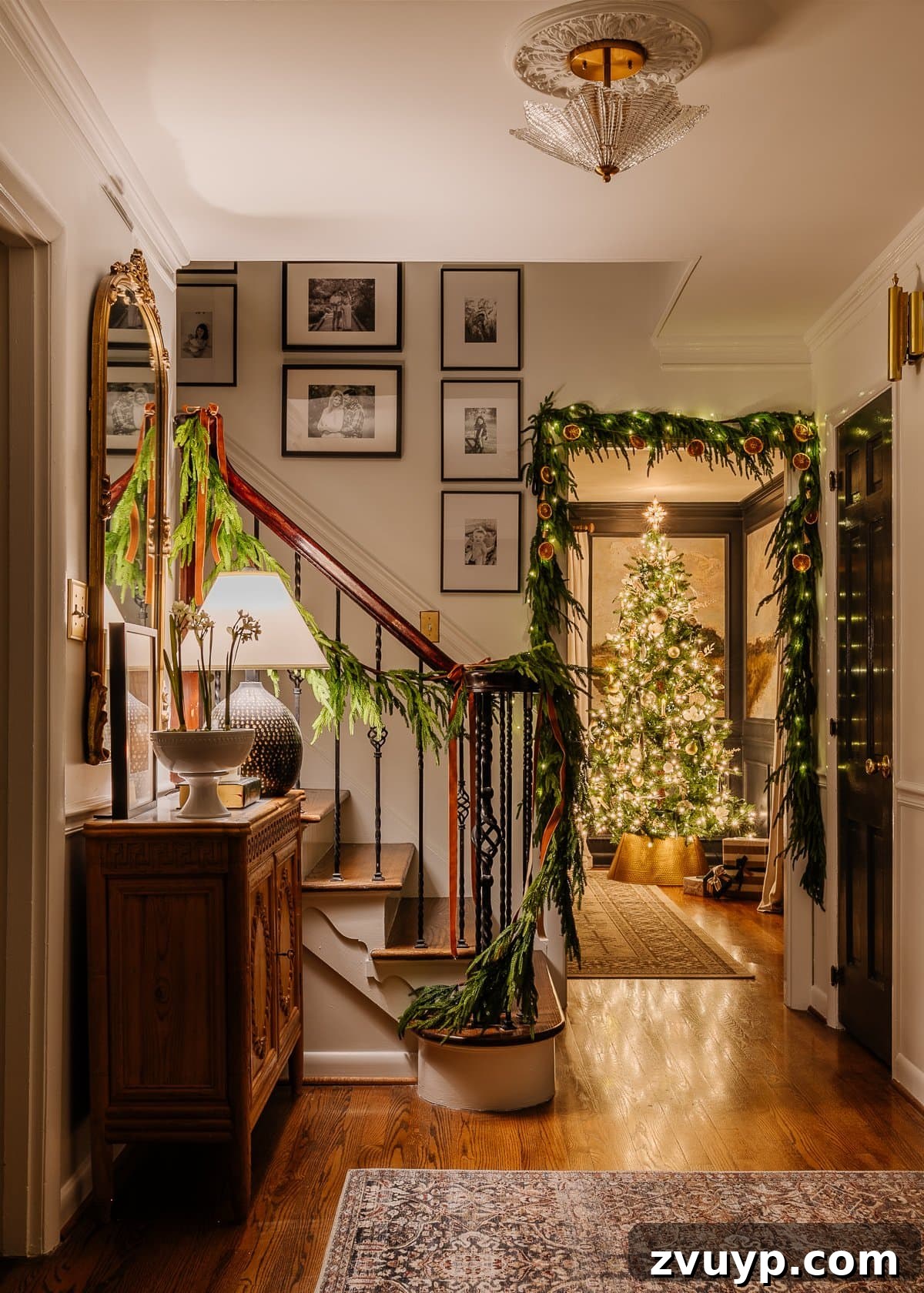 Enchanted Glow Tour 3 Christmas candlelight in a beautifully decorated foyer, featuring warm lighting and festive accents, creating a welcoming and elegant entrance for holiday guests.