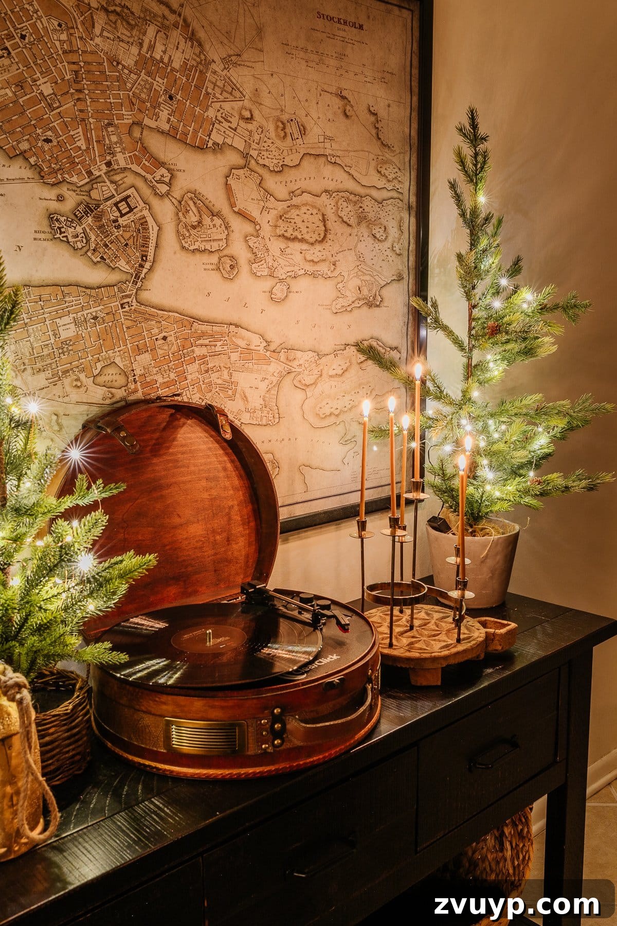 Enchanted Glow Tour 25 A beautiful candlelight Christmas console table decorated for the holidays, featuring elegant festive accents and a warm, inviting glow that enhances the nighttime ambiance.
