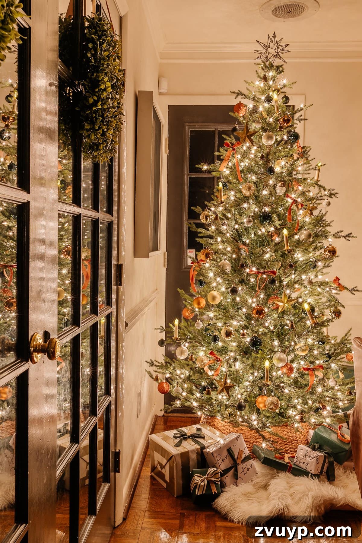 Enchanted Glow Tour 30 A beautiful candlelight Christmas tree glowing softly at night in a living room, radiating warmth and creating a magical, peaceful holiday ambiance.