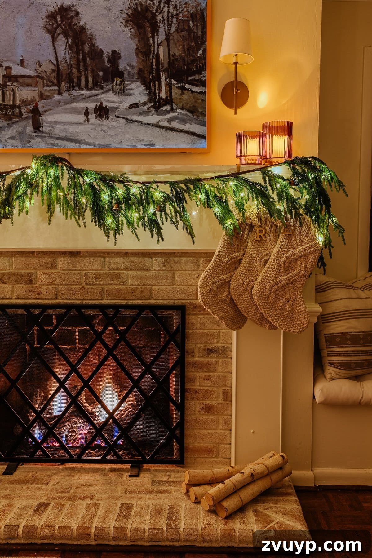 Enchanted Glow Tour 34 A beautifully decorated Christmas fireplace at night, with stockings hung and a warm glow emanating from the hearth, creating a classic and inviting holiday scene.