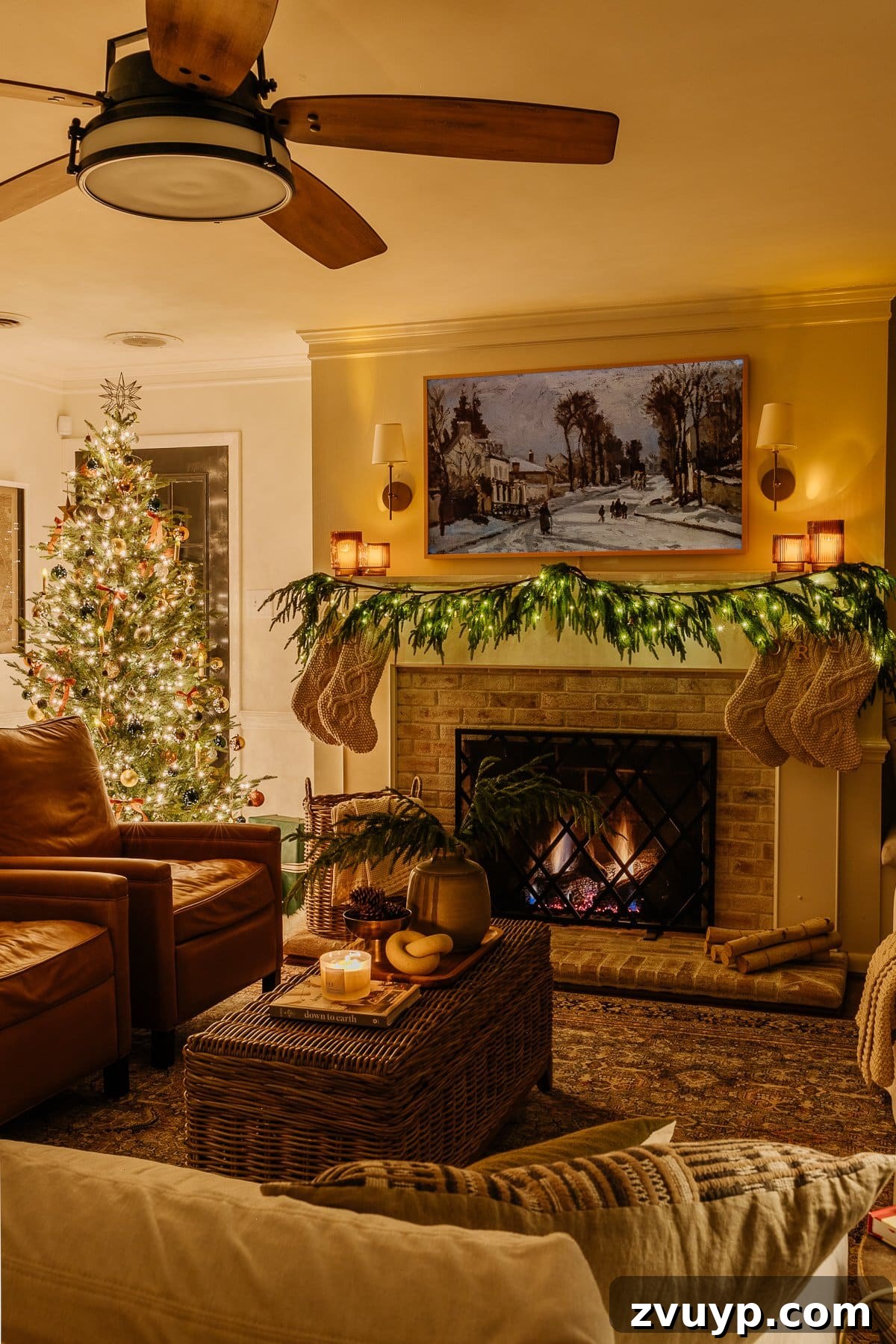 Enchanted Glow Tour 35 A stunning Christmas tree and fireplace at night, beautifully decorated for the holidays, creating a warm, festive, and inviting focal point in the living room.