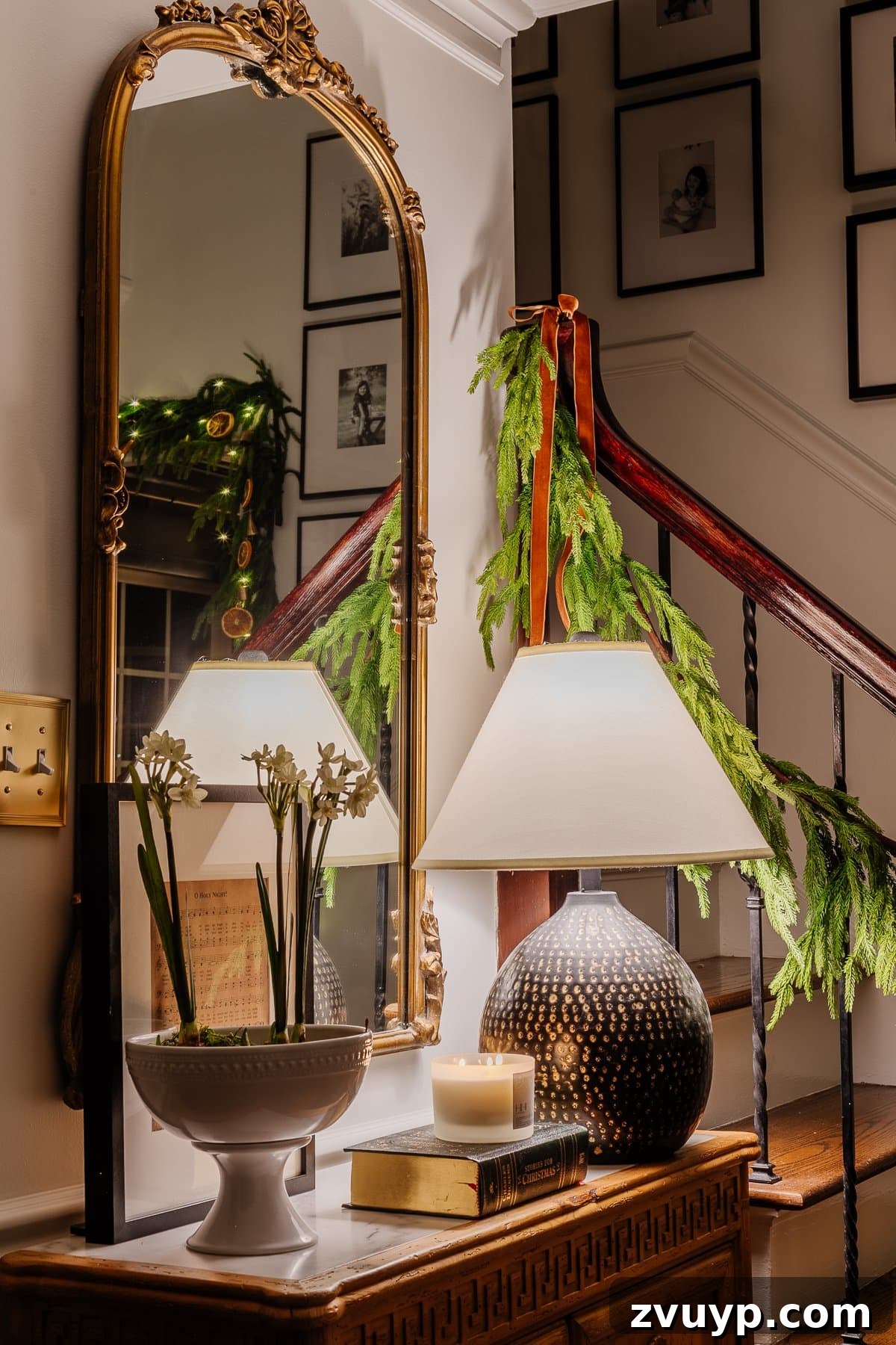 Enchanted Glow Tour 5 A warm and inviting Christmas candlelight scene in the foyer, decorated for the holidays with subtle yet elegant festive touches, enhancing the home's nighttime charm.