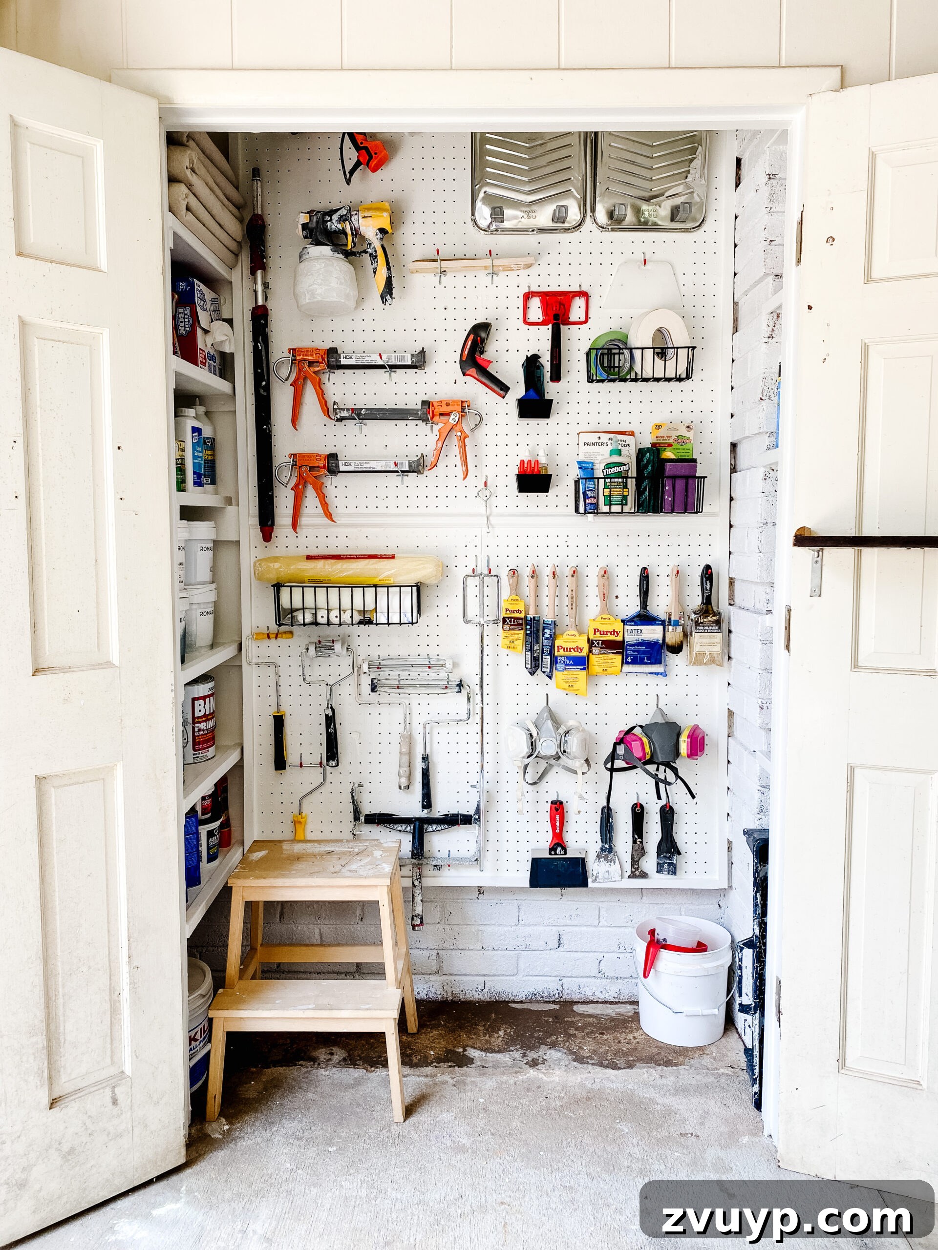 Our 21 Most Impressive Room Transformations of 2021 26 After: Our organized paint storage closet with new shelves and clearly labeled supplies.