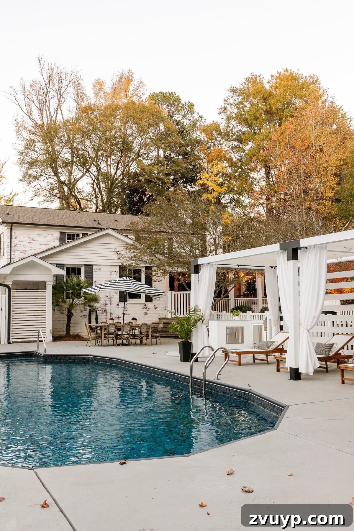 Our 21 Most Impressive Room Transformations of 2021 42 After: Our renovated backyard oasis with a new fence, lush landscaping, and inviting outdoor areas.