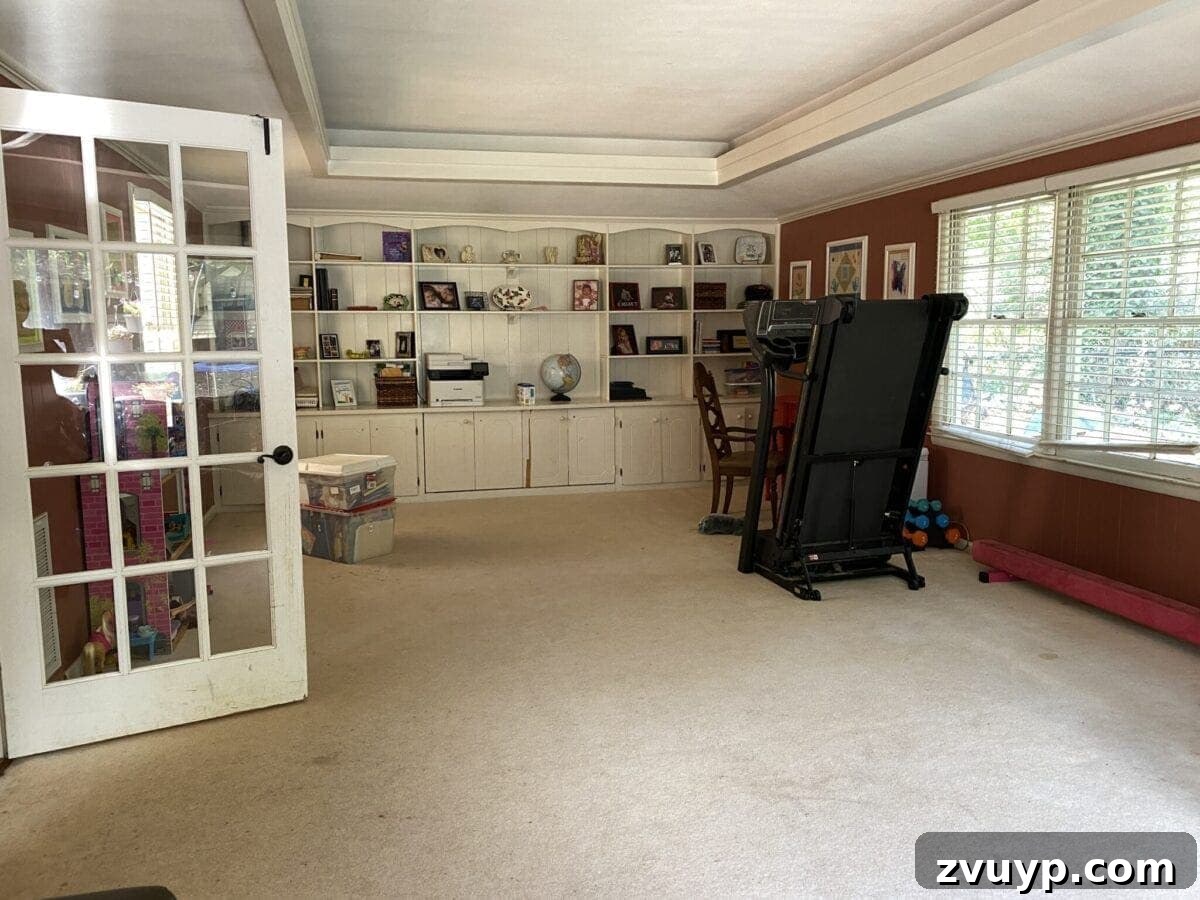 Our 21 Most Impressive Room Transformations of 2021 6 Before: The Carney family's cluttered rec room before renovation.