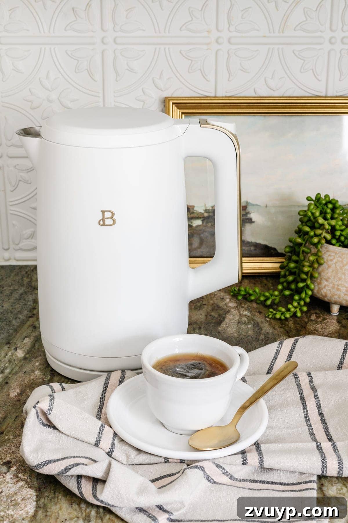 Your 2021 Product Champions 2 Sleek white electric kettle on a modern kitchen counter, perfect for quickly boiling water for tea, coffee, or instant meals, a top Amazon kitchen essential.