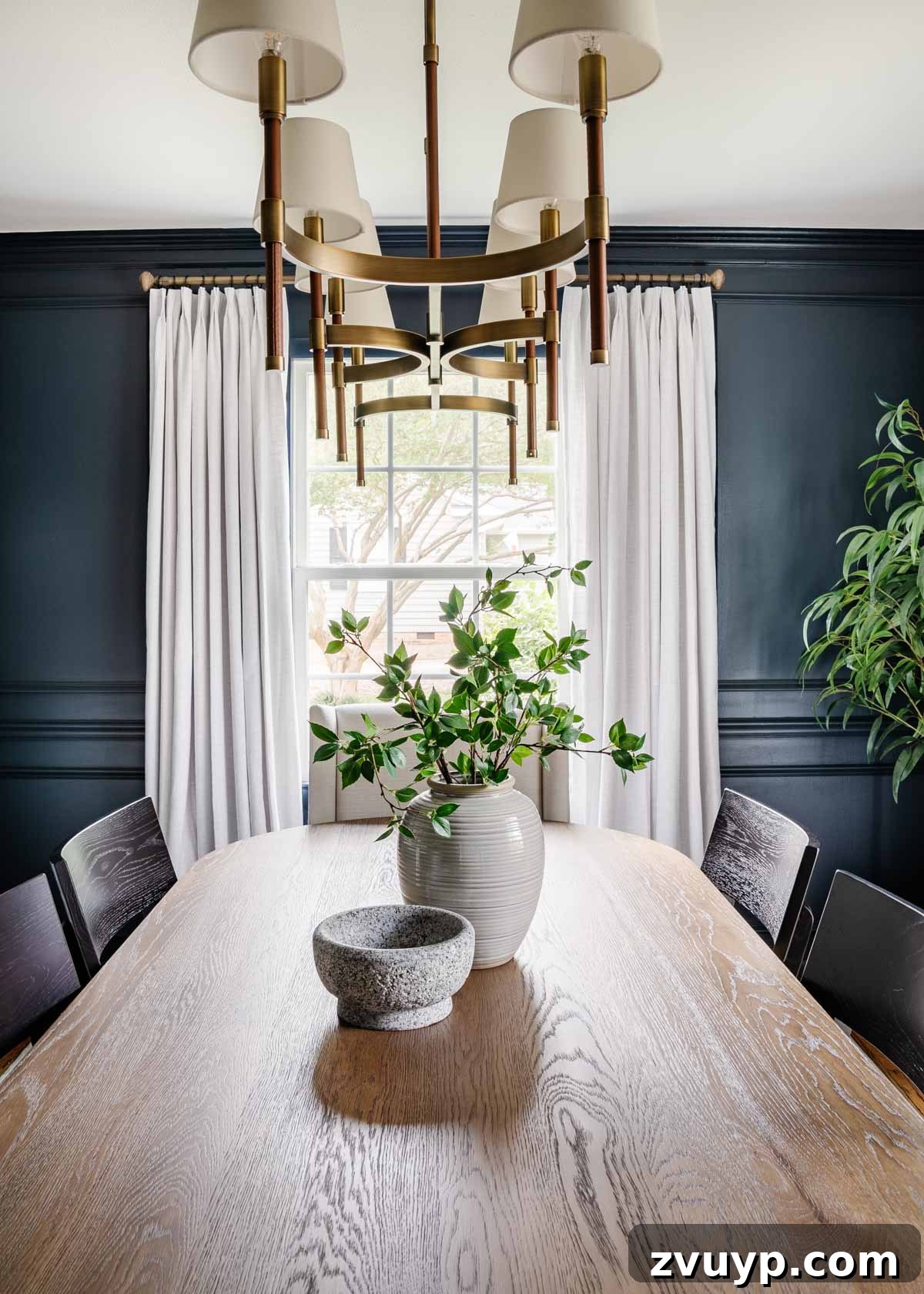 Your 2021 Product Champions 5 Elegant wooden curtain rod with finials, supporting light-colored curtains in a dining room, a timeless home decor accent.