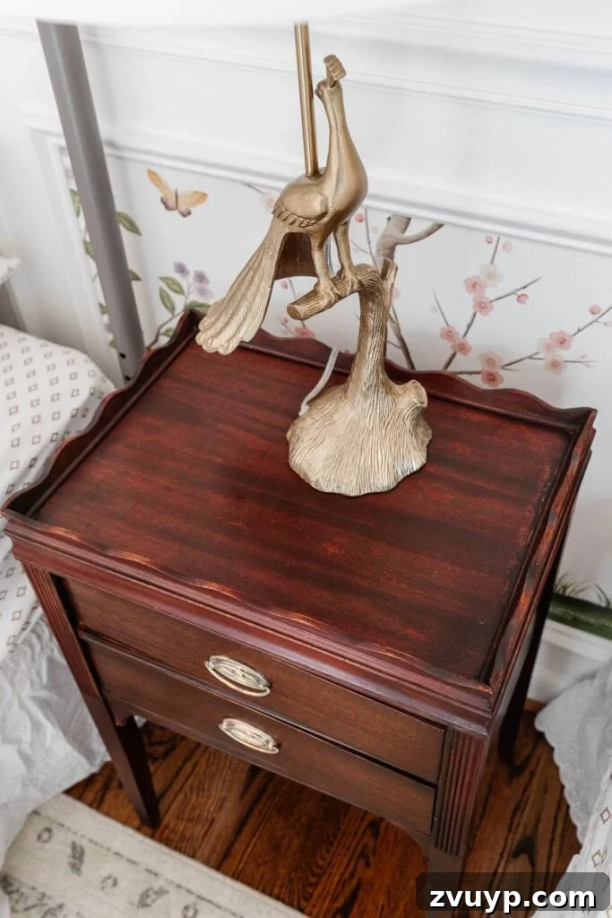 Make Old Wood Furniture Look Brand New 7 Hand applying cleaning solution to wood furniture with a rag
