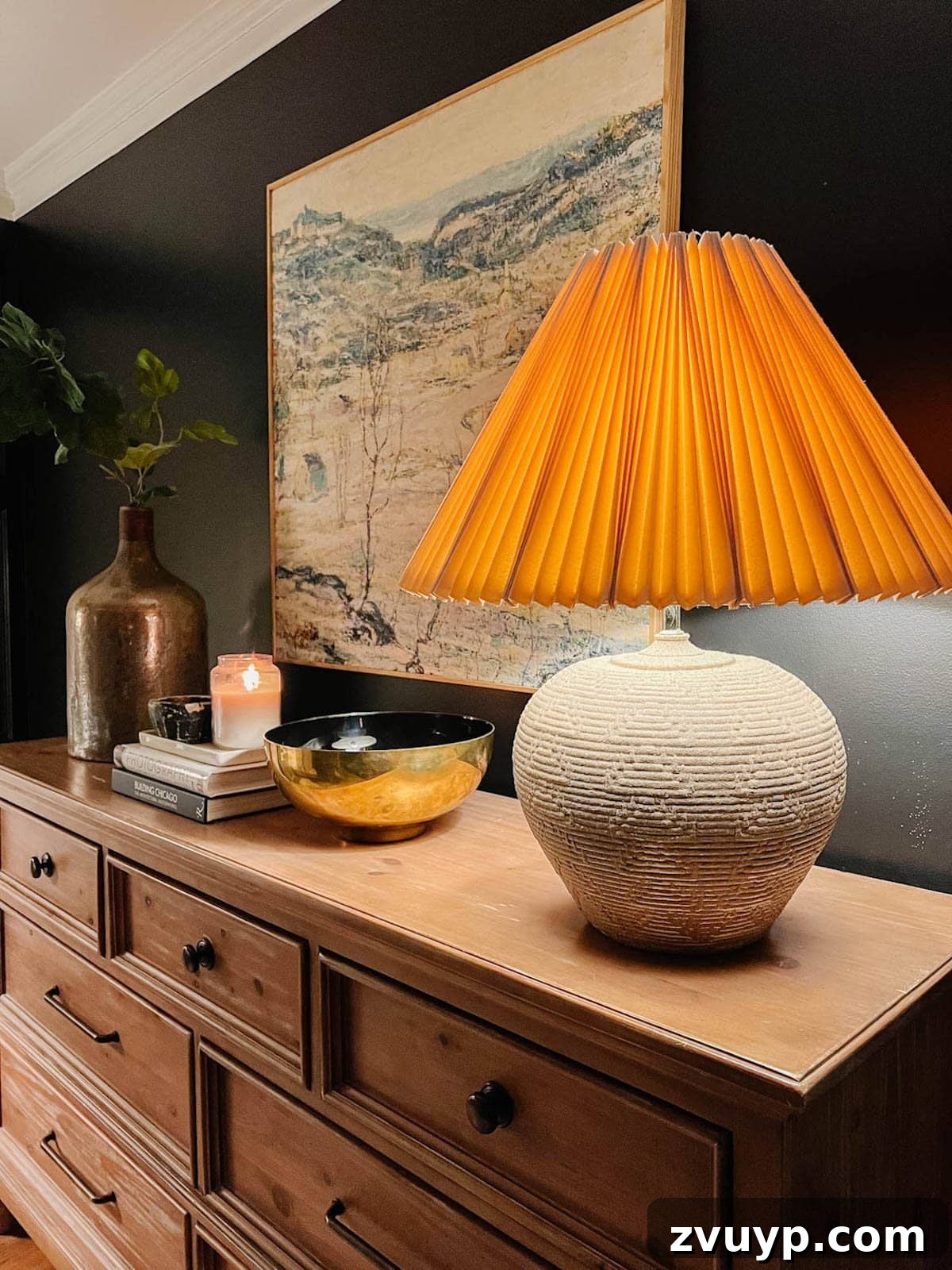 DIY Rustic Table Lamp Makeover: Create Inexpensive Designer Dupes 4 concrete textured rustic table lamp with pleated lamp shade on bedroom dresser with black walls