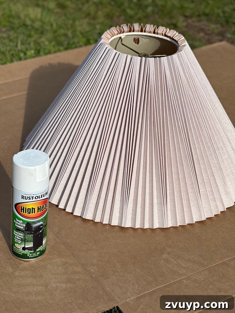 DIY Rustic Table Lamp Makeover: Create Inexpensive Designer Dupes 8 spray painting a pleated lamp shade