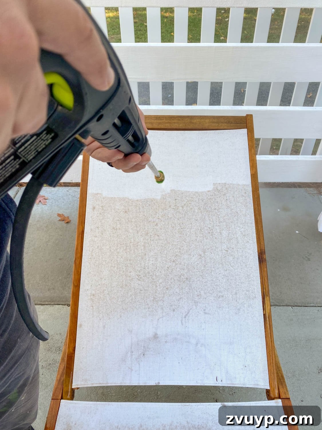 Revive Your Outdoor Oasis: Expert Cleaning for Cushions and Furniture 6 Power washing outdoor cushions and patio furniture with vinegar for deep cleaning.