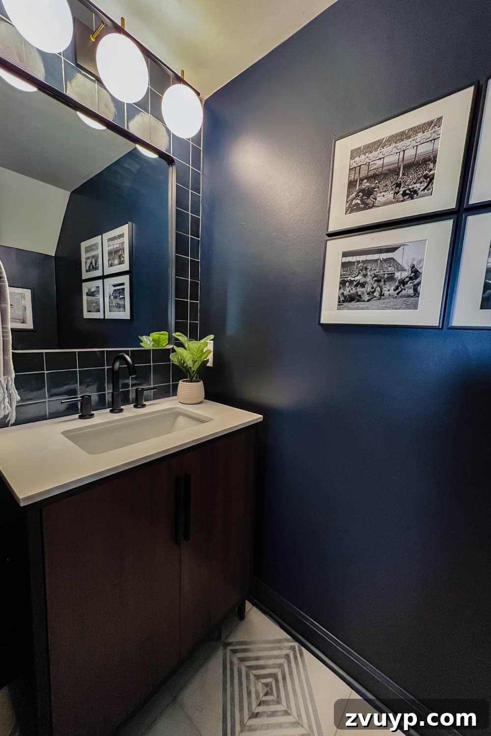 Sleek & Compact: Bachelor Pad Powder Room Makeover 7 vintage football art prints in a masculine bachelor pad powder room, reflecting light from the satin-sheen walls