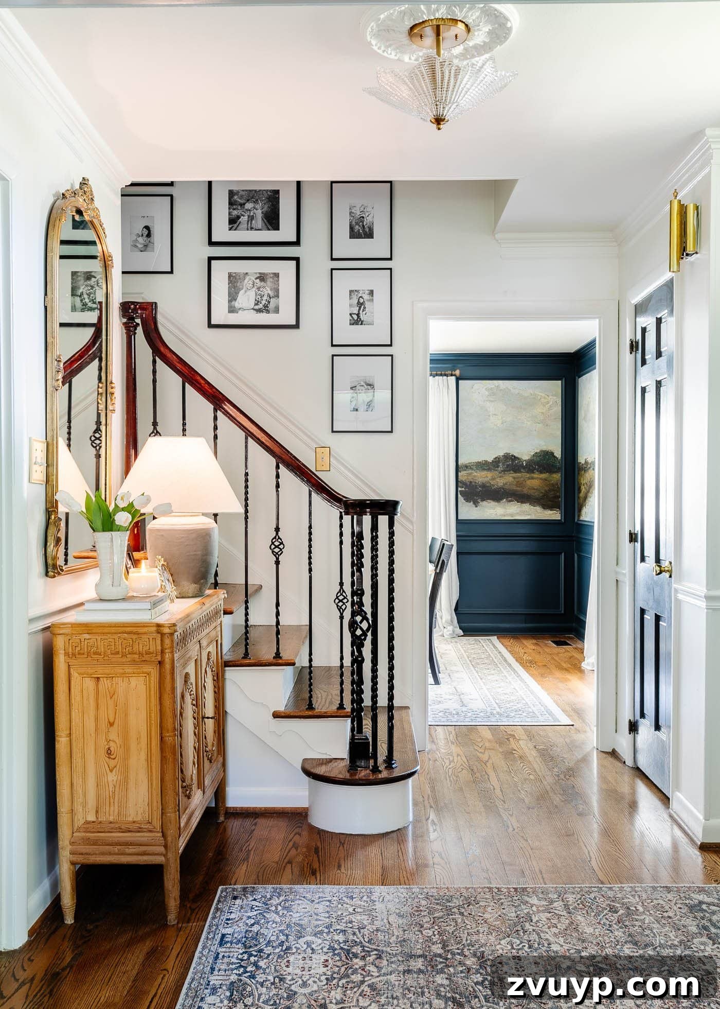 Pro Entry Table Styling: Your Step-by-Step Guide to a Stunning Entryway 2 foyer with entry chest, mirror, and stairway gallery wall