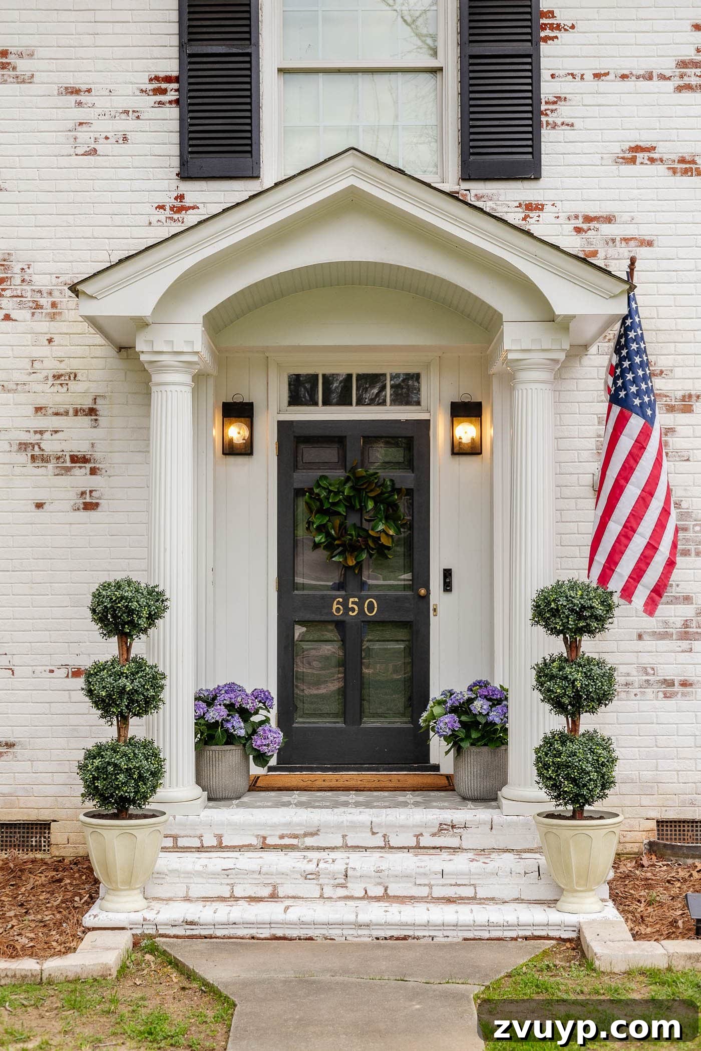 Tiny Porch, Big Curb Appeal: 6 Budget-Friendly Upgrades 7 colonial small front porch on a limewashed brick house with symmetrical boxwood topiaries and hydrangeas in elegant planters