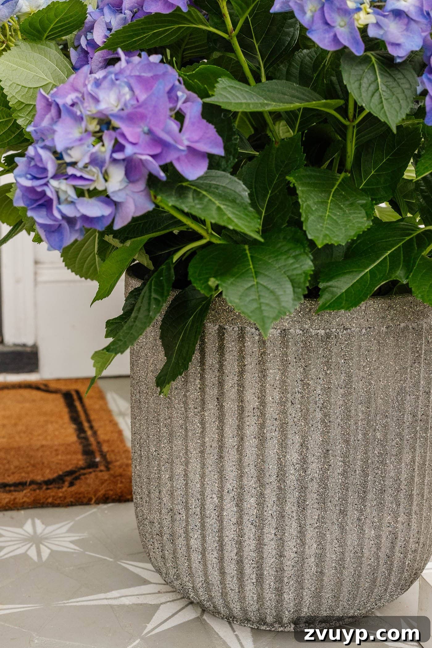 DIY Faux Concrete Planters: The Spray Paint Secret 11 close up of fluted faux DIY concrete planters made with spray paint on cheap resin planters