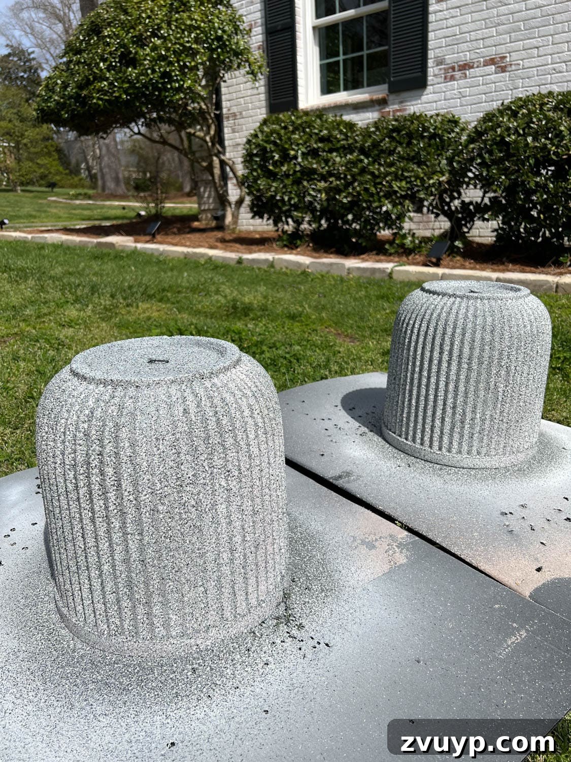DIY Faux Concrete Planters: The Spray Paint Secret 5 spray painting outdoor planters light gray with texture to look like concrete