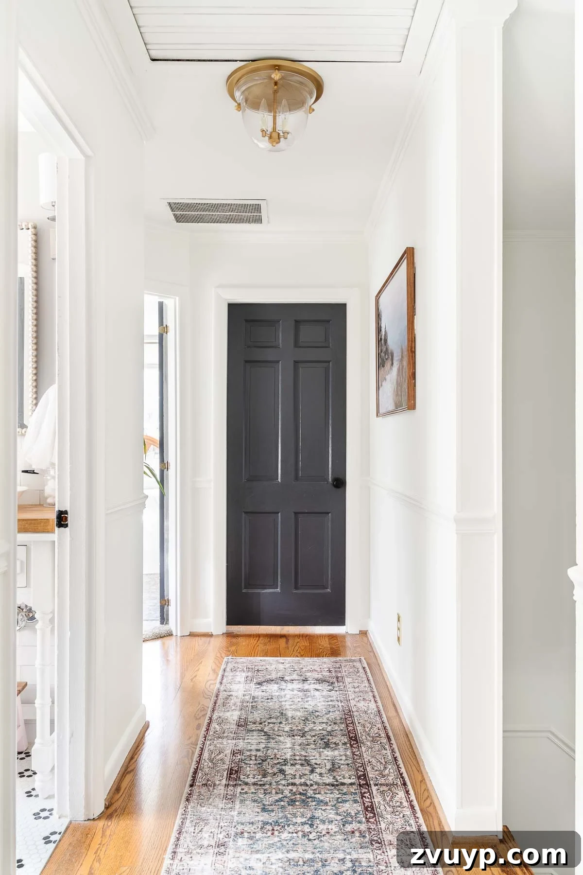 Faux Luxury Home Style for Less 3 white hallway with black doors
