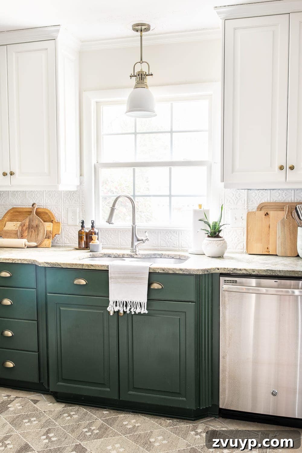 Faux Luxury Home Style for Less 26 white pressed tin backsplash in a kitchen with white and green cabinets