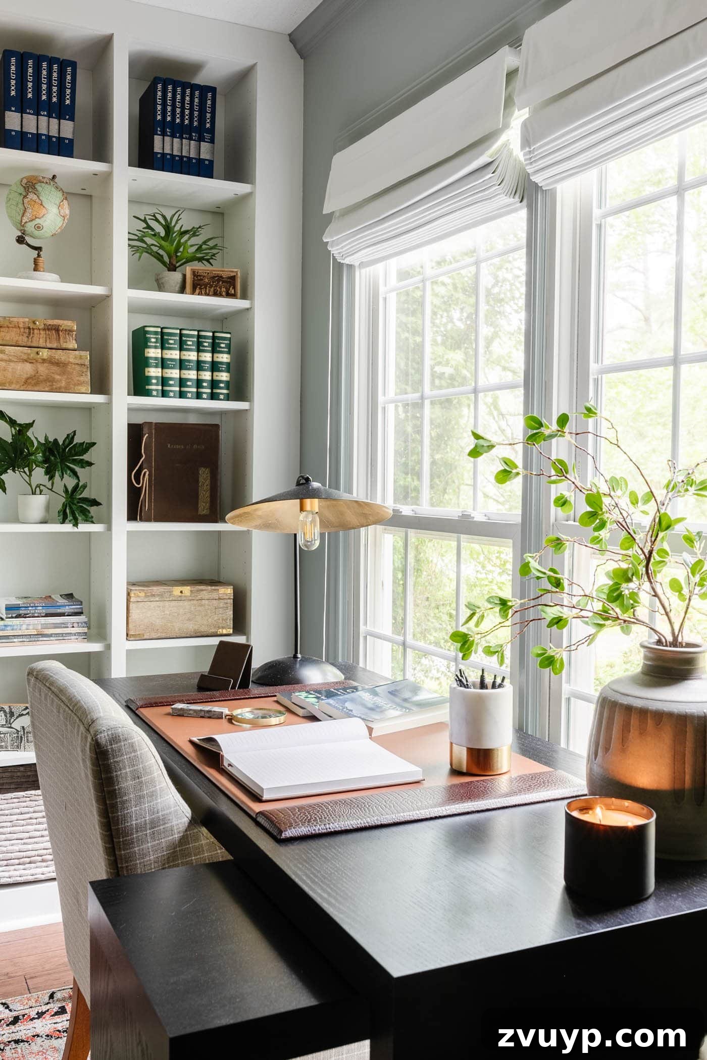 Elevate Your Home Office Setup Smart Tips Plus Full Reveal 4 black office desk in front of window with desk pad, desk lamp, vase of branches, and shelving