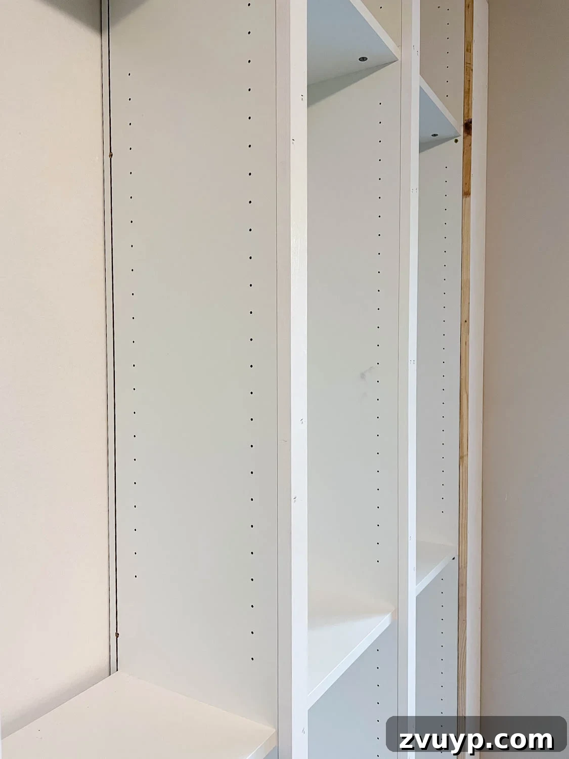 The IKEA Billy Hack: Custom Built-In Bookshelves Made Easy 20 trimmed 1x10 board to fit the front of bookcases and fill the gap to make them look built in for the IKEA Billy bookcase hack