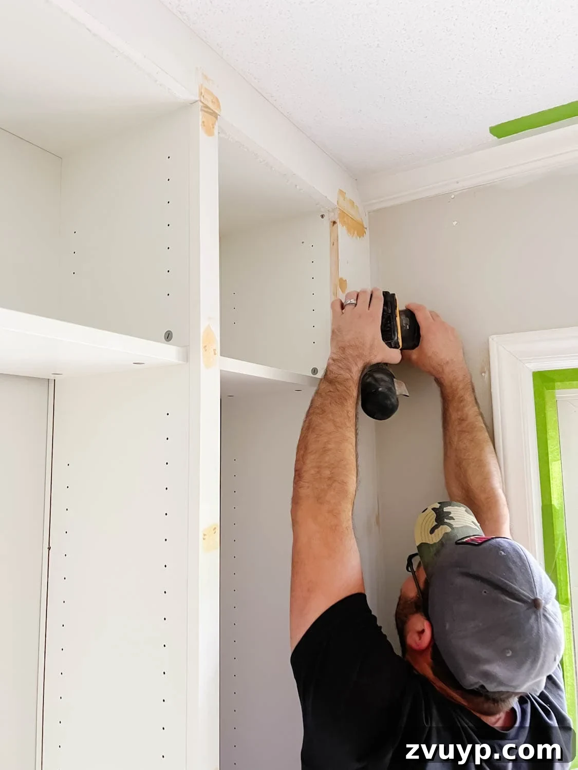 The IKEA Billy Hack: Custom Built-In Bookshelves Made Easy 24 orbital sander used to smooth out wood filler and Loctite foam