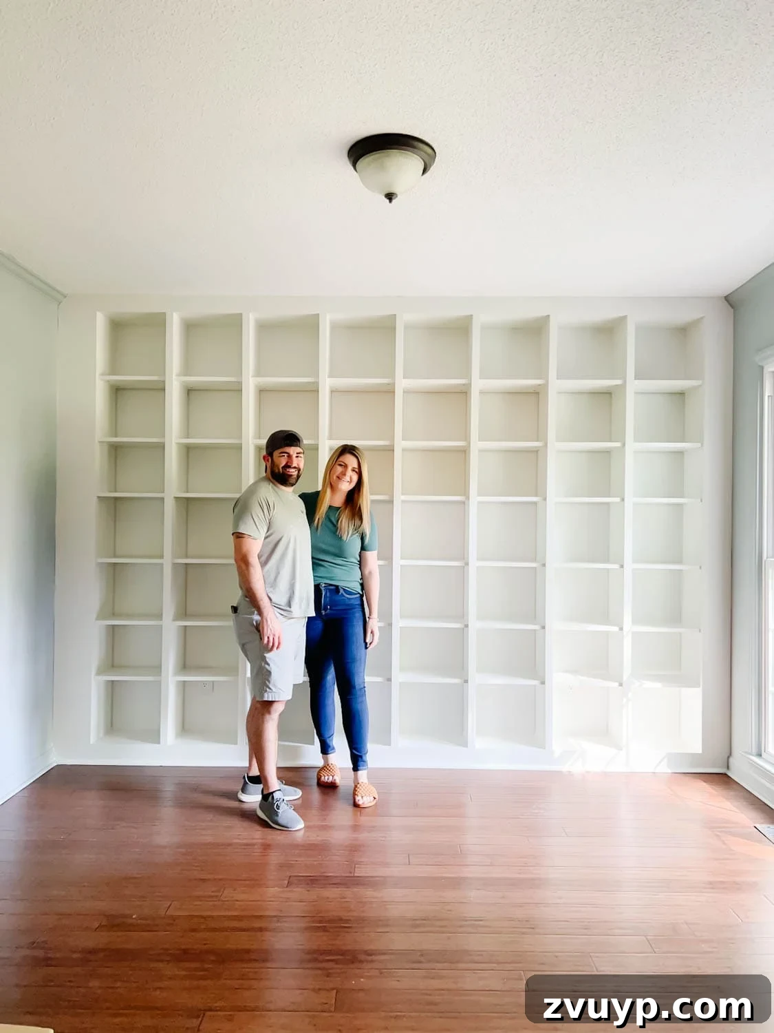 The IKEA Billy Hack: Custom Built-In Bookshelves Made Easy 26 newly painted IKEA Billy bookcase shelves to make them look like one solid built in piece