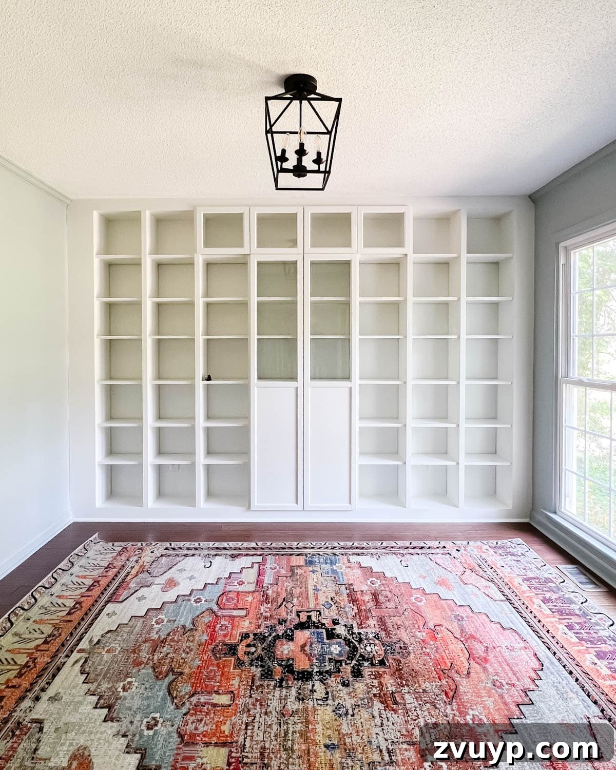 The IKEA Billy Hack: Custom Built-In Bookshelves Made Easy 27 Oxberg doors added to bookcases for concealed storage