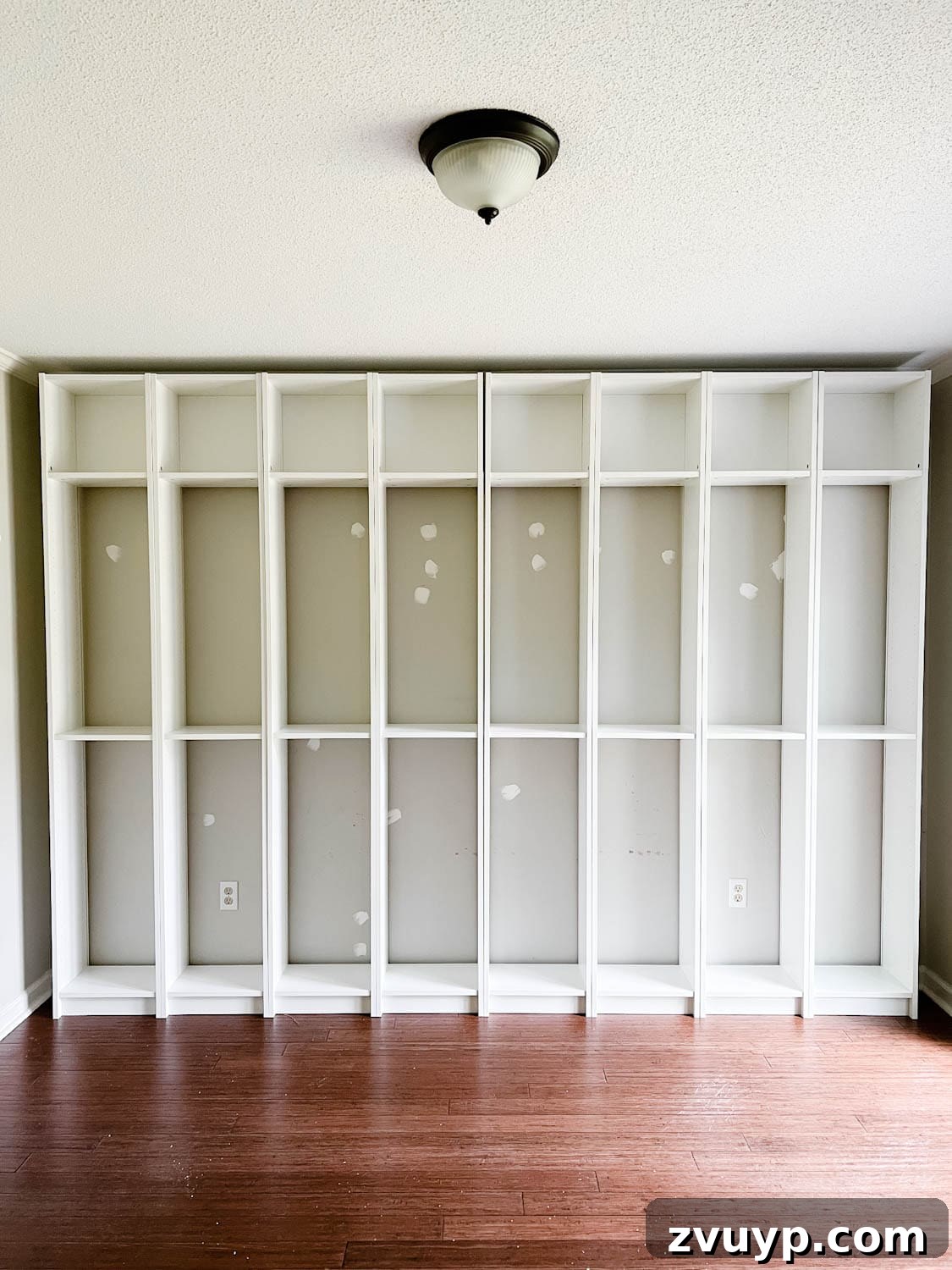 The IKEA Billy Hack: Custom Built-In Bookshelves Made Easy 5 assembled IKEA Billy bookcases ready to make into built in bookshelves