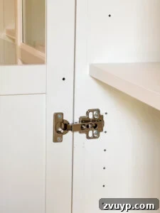 The IKEA Billy Hack: Custom Built-In Bookshelves Made Easy 41 attaching hinges and hardware to doors to hang on bookcase