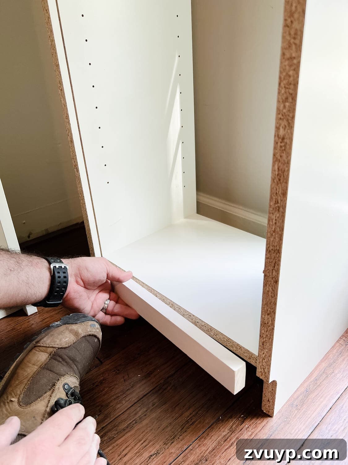 The IKEA Billy Hack: Custom Built-In Bookshelves Made Easy 7 adding a 1x2 to the back of a bookcase to fill a gap to make diy built in bookshelves