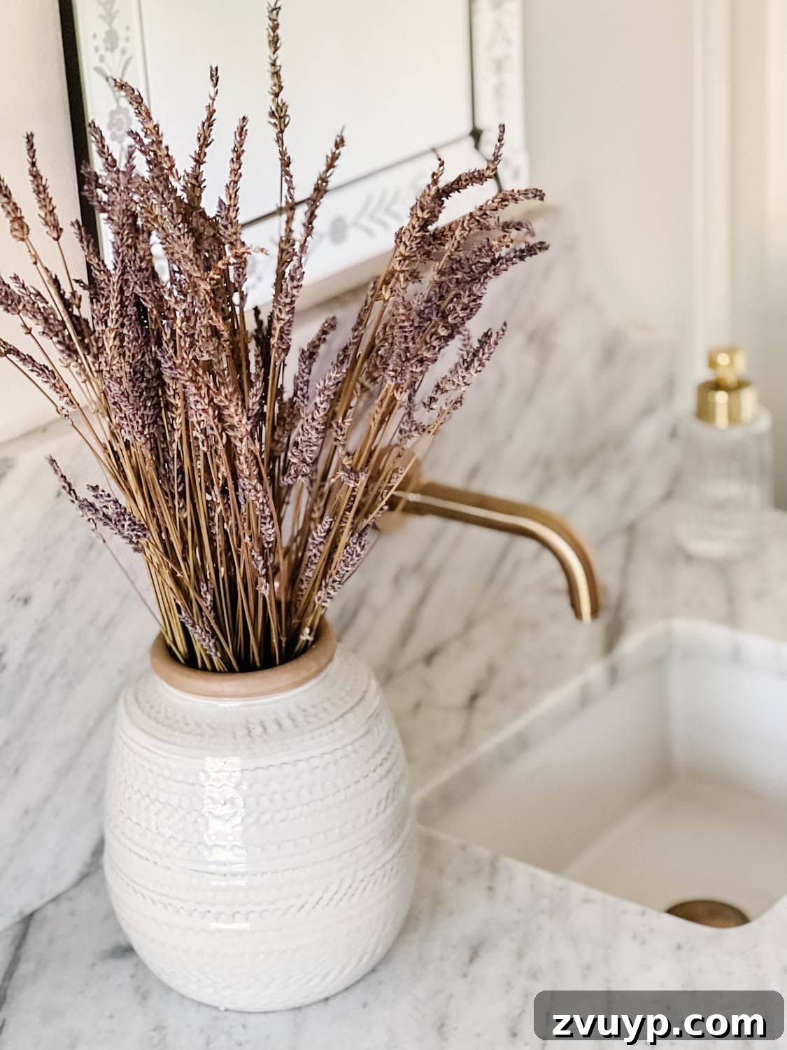 Spa Chic on a Shoestring: Elevate Your Bathroom 7 dried lavender in a vase as bathroom decor on a vanity for a spa bathroom experience at home