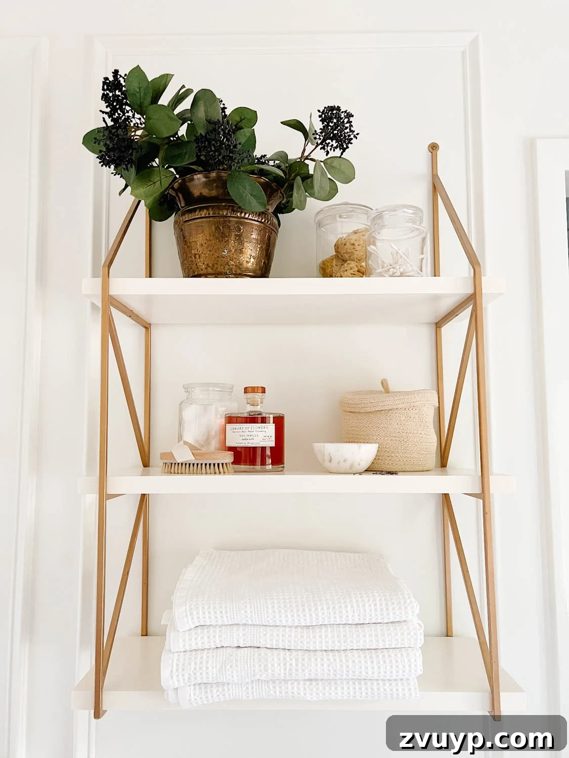 Spa Chic on a Shoestring: Elevate Your Bathroom 9 open shelving in a bathroom with apothecary jars and waffle weave towels
