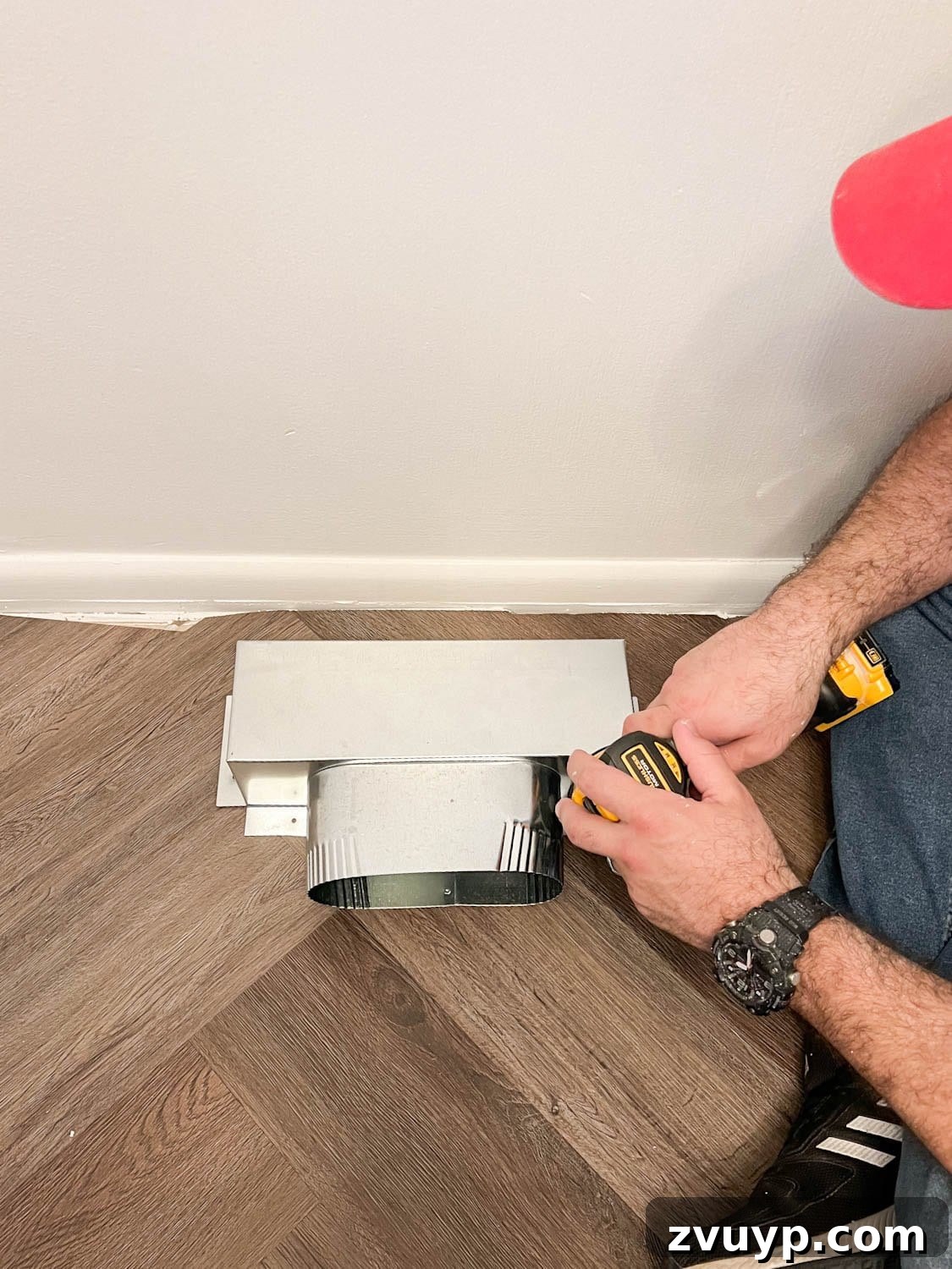 Corner Banquette Refresh and Hidden Vent Hacks 7 Attaching the Toe Ductor box firmly over the existing floor air vent using screws, preparatory to built-in installation.