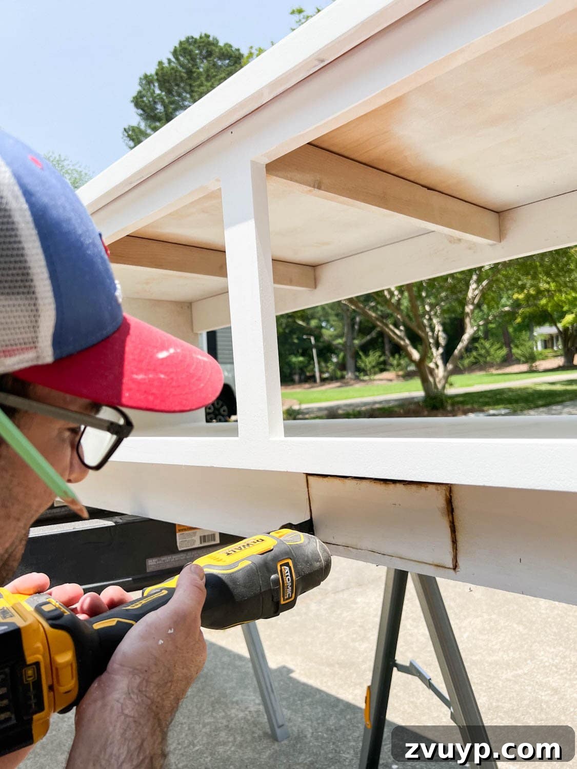 Corner Banquette Refresh and Hidden Vent Hacks 8 Using an oscillating multi-tool to precisely cut a rectangular opening in the banquette's toe kick for the new air vent.