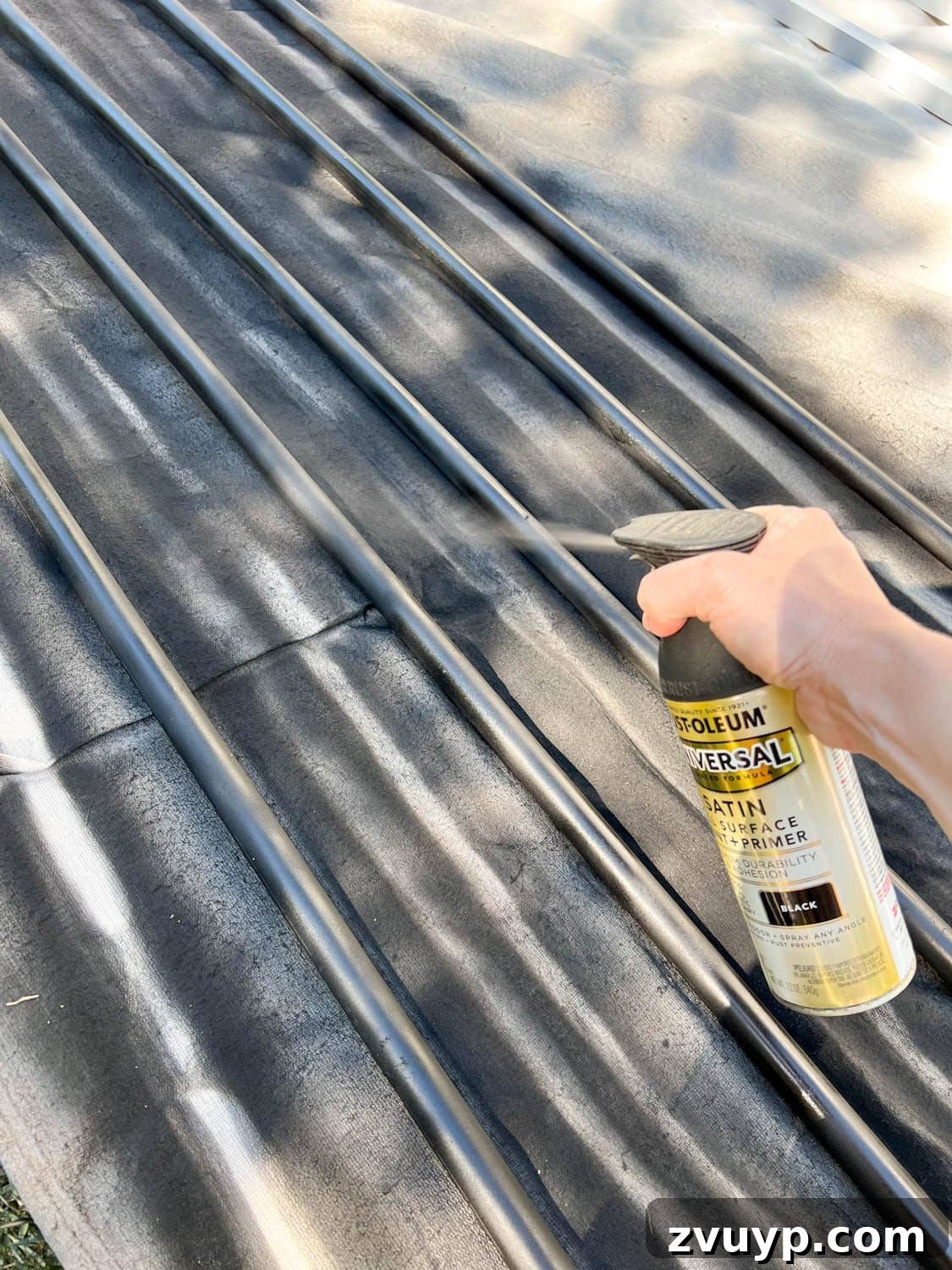 No Poles, No Problem: Creative Ways to Hang Backyard String Lights 13 spray painting conduit black to make DIY string light poles