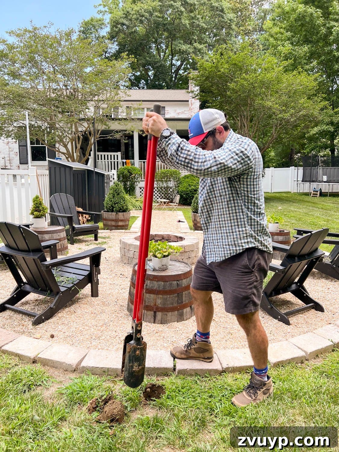 No Poles, No Problem: Creative Ways to Hang Backyard String Lights 14 using a post hole digger to dig holes for string light poles around a fire pit