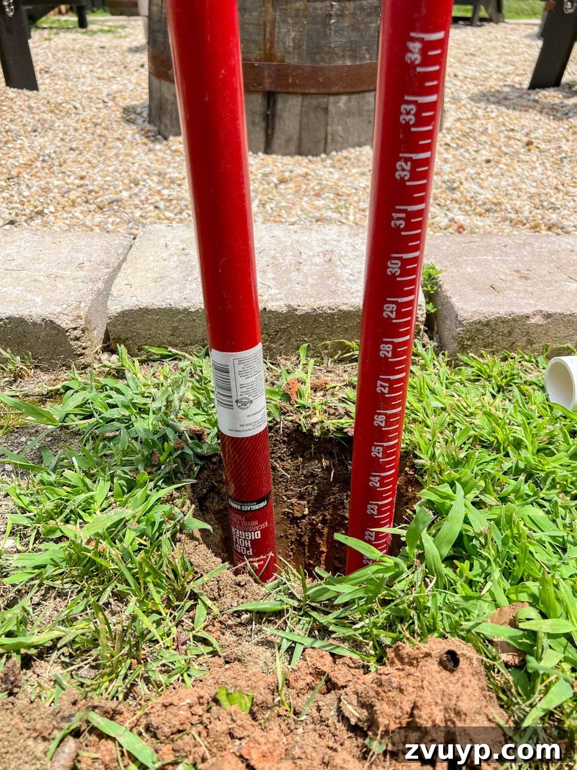 No Poles, No Problem: Creative Ways to Hang Backyard String Lights 15 a post hole digger in a hole 2 feet deep