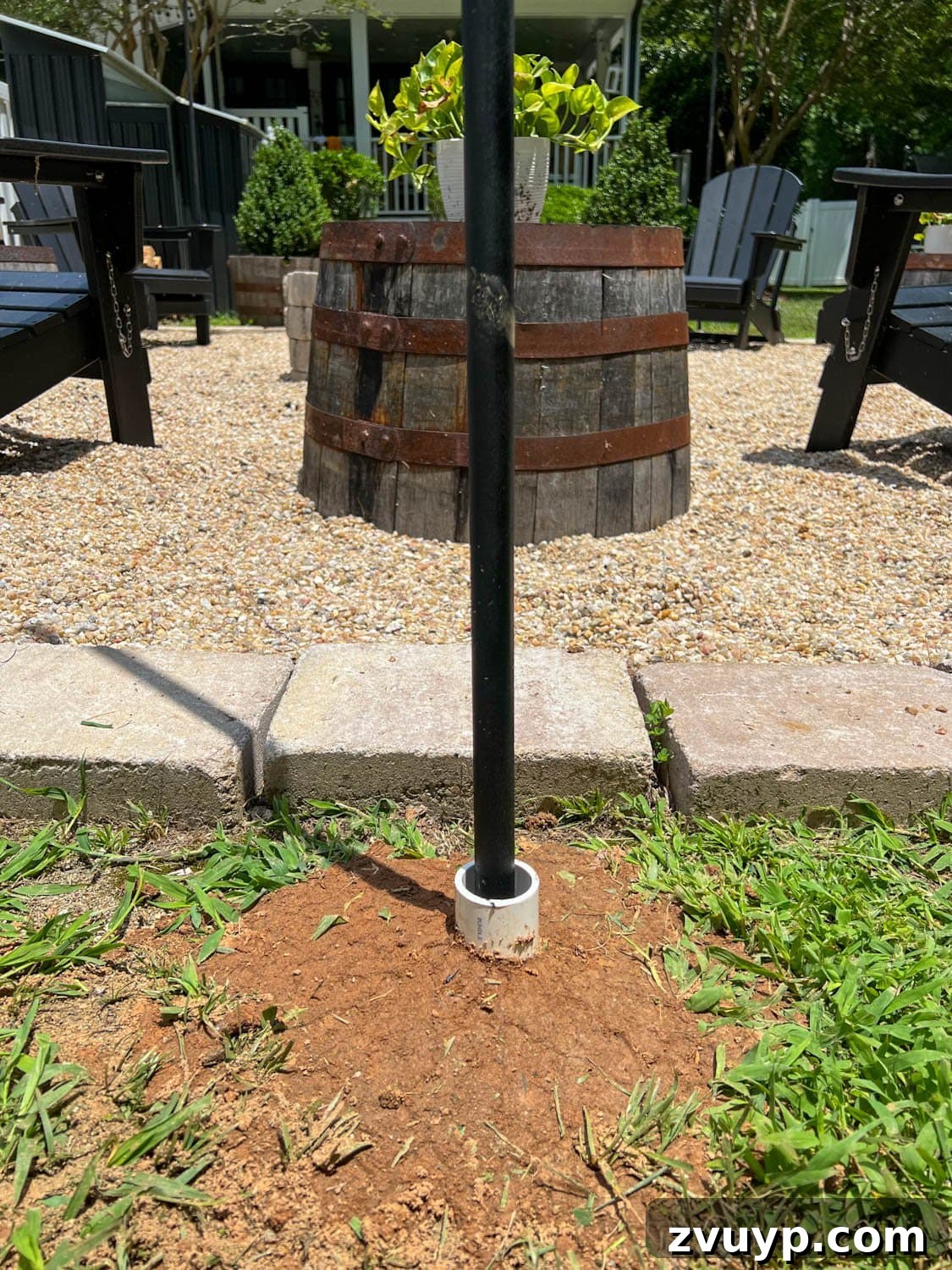 No Poles, No Problem: Creative Ways to Hang Backyard String Lights 18 DIY string light pole in the ground with PVC pipe to anchor it