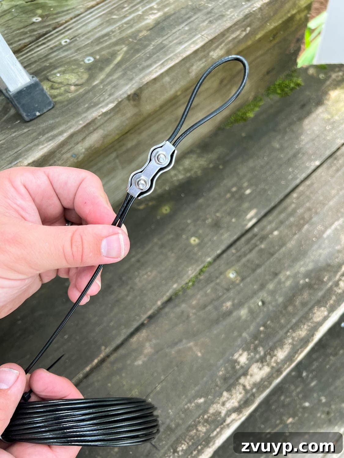 No Poles, No Problem: Creative Ways to Hang Backyard String Lights 22 making a cable loop to rig lights from a bracket