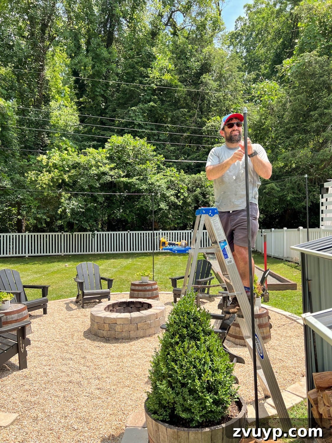 No Poles, No Problem: Creative Ways to Hang Backyard String Lights 23 attaching a cable system to DIY string light poles for stability