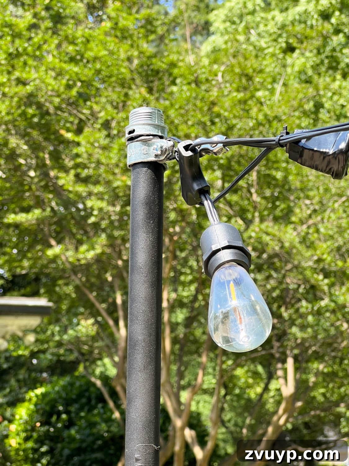 No Poles, No Problem: Creative Ways to Hang Backyard String Lights 25 string lights attached to poles with squeeze connectors screwed to cable